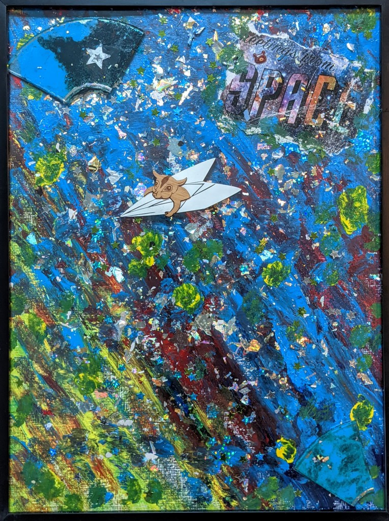 Blue, yellow and a splash of magenta acrylic paint adorned with a painted broken CD, glitter, a critter in an airplane with a message in corner that says "Greetings From Space."